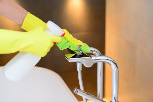 Carpet cleaner preparing equipment safely before a cleaning job