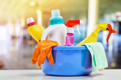 Carpet cleaning technician preparing equipment safely in a home